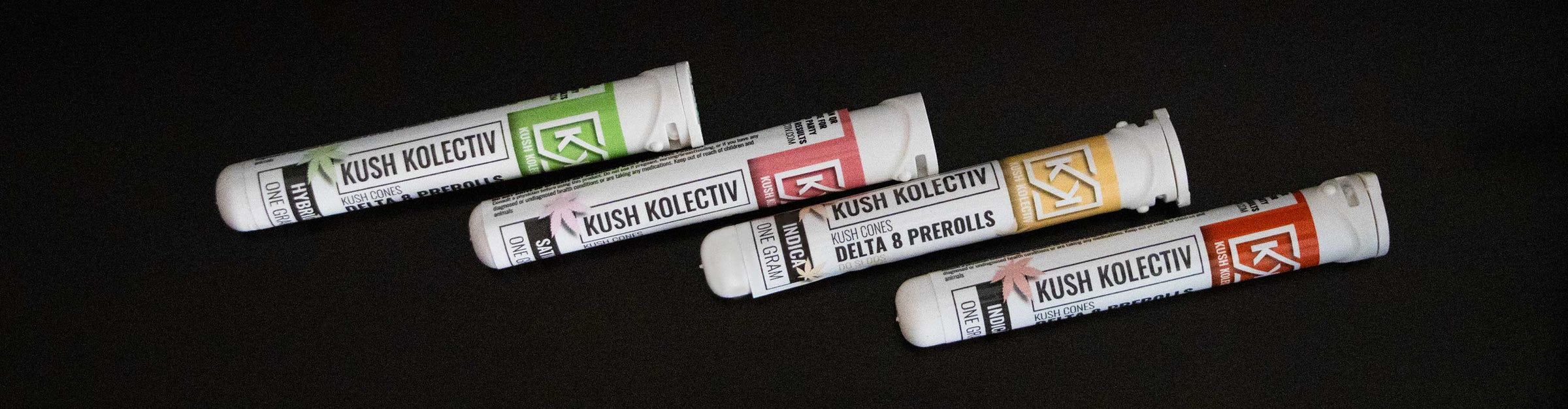 Kush Kolectiv Pre Rolls laying down on black coffee table