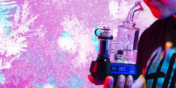 Man holding Exxus go Plus in front of frosted pink studio background