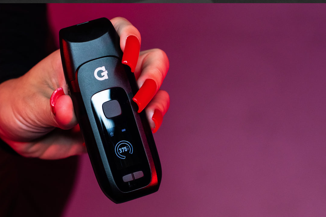 Woman holding GPEN Dash with dark red background