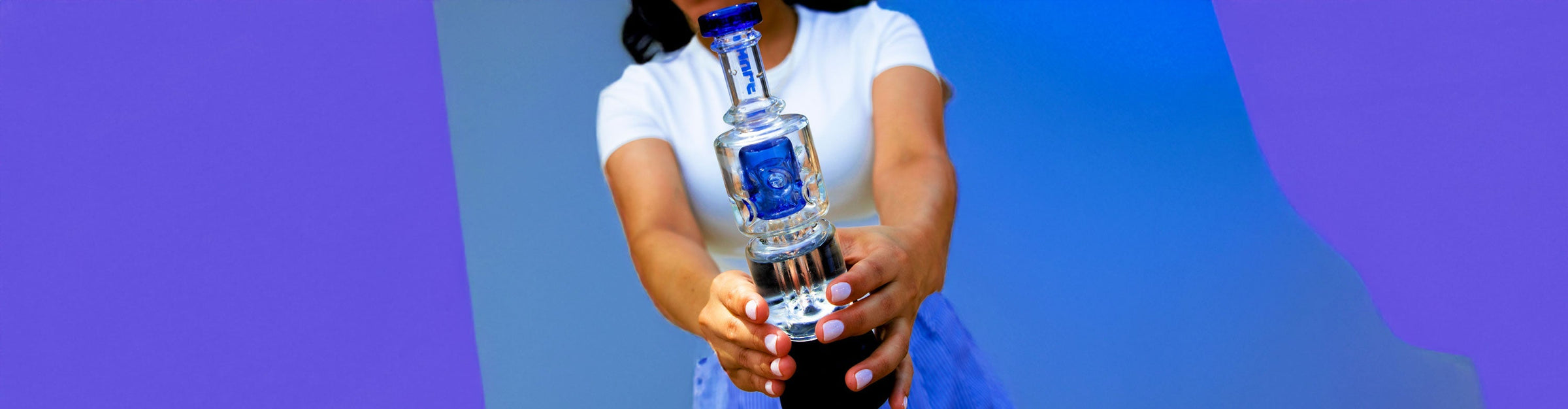 Woman holding Wulf Fuse in front of blue and purple studio background