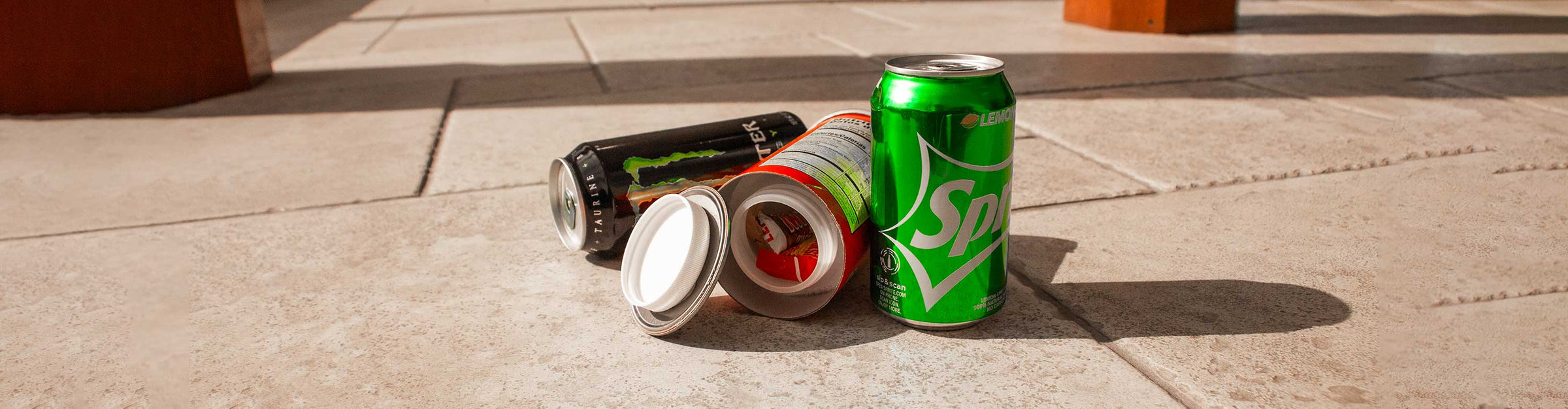 Diversion Safe Cans standing on office floor with one lid open