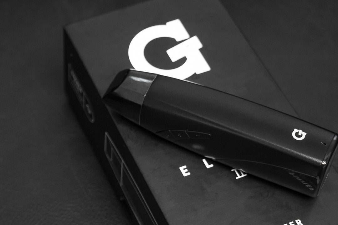 G Pen Elite 2 laying down on top of box on an office table
