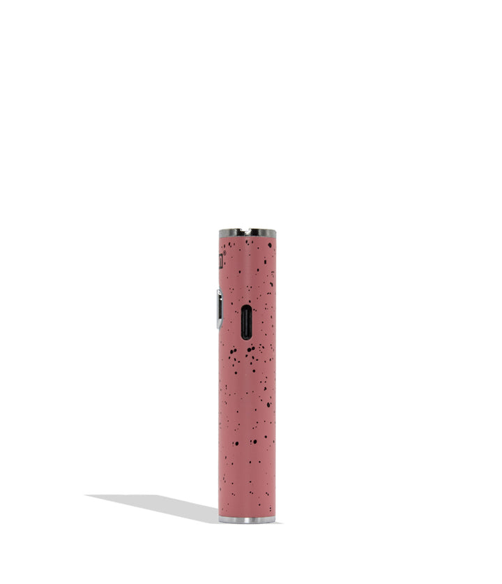 A pink cylindrical vape device with a black speckled pattern and silver metal accents, standing vertically on a white background with a soft shadow.