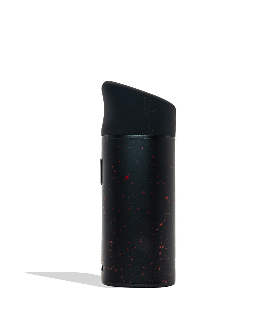 WULF MODS Pocket Mini concentrate vaporizer in black with red spatter pattern details, featuring a vertical rainbow LED indicator light on the side, shown against a plain white background. Side view