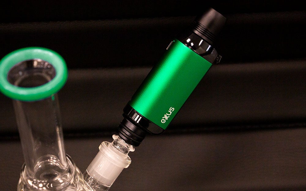 Exxus VRS Dab Rig Mode on water pipe standing on table with black background