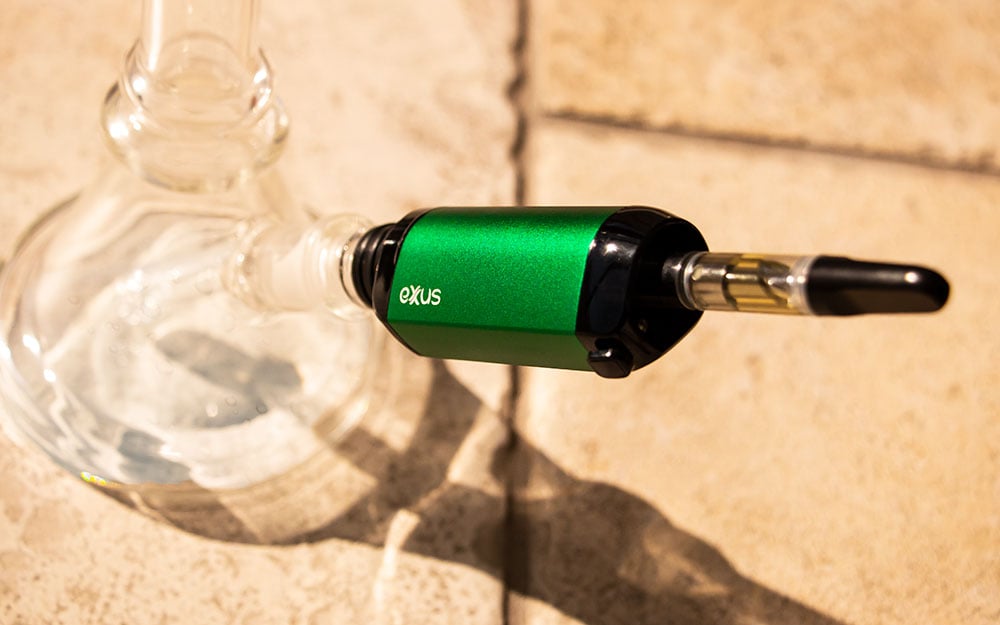 Exxus VRS Cartridge with Water Pipe standing on office floor with sunlight