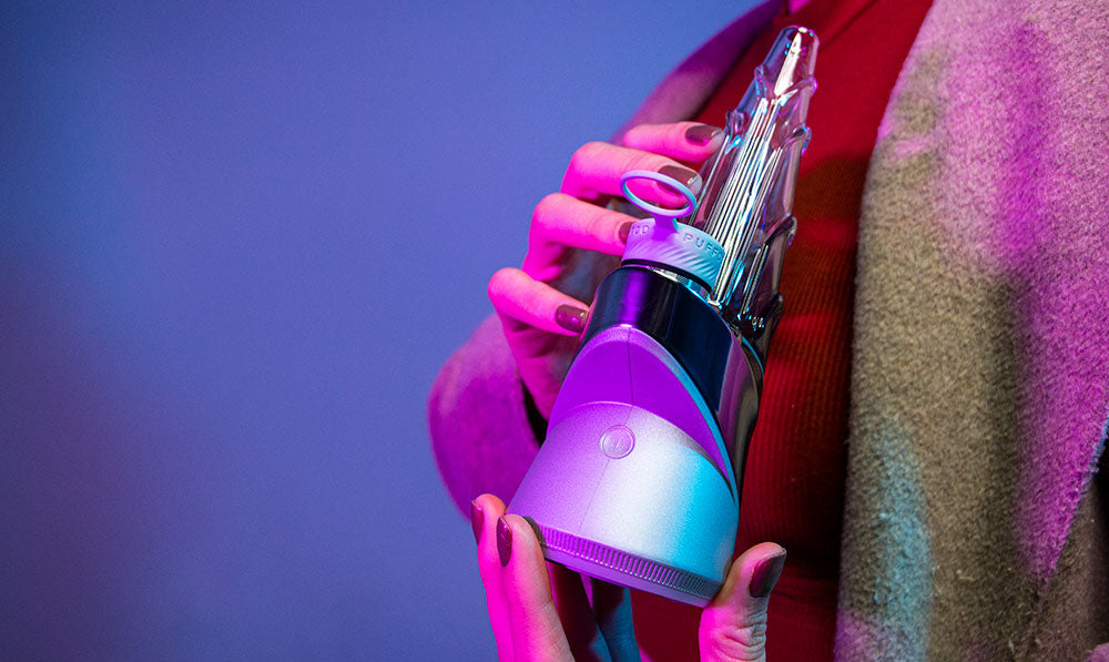 Person holding a Puffco Peak Pro Guardian electronic rig