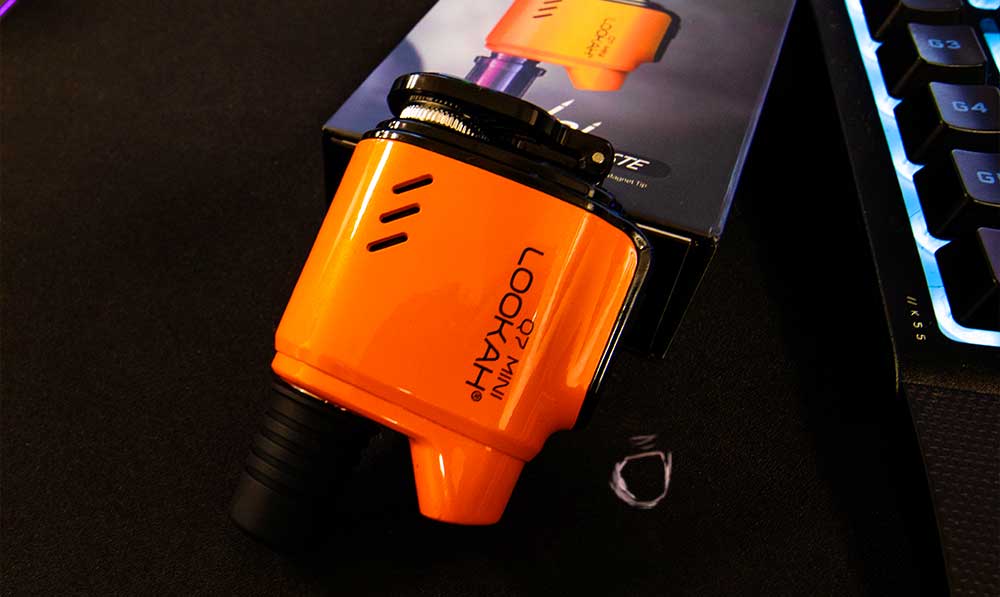 Orange Lookah Q7 Mini 510 thread battery on a dark surface