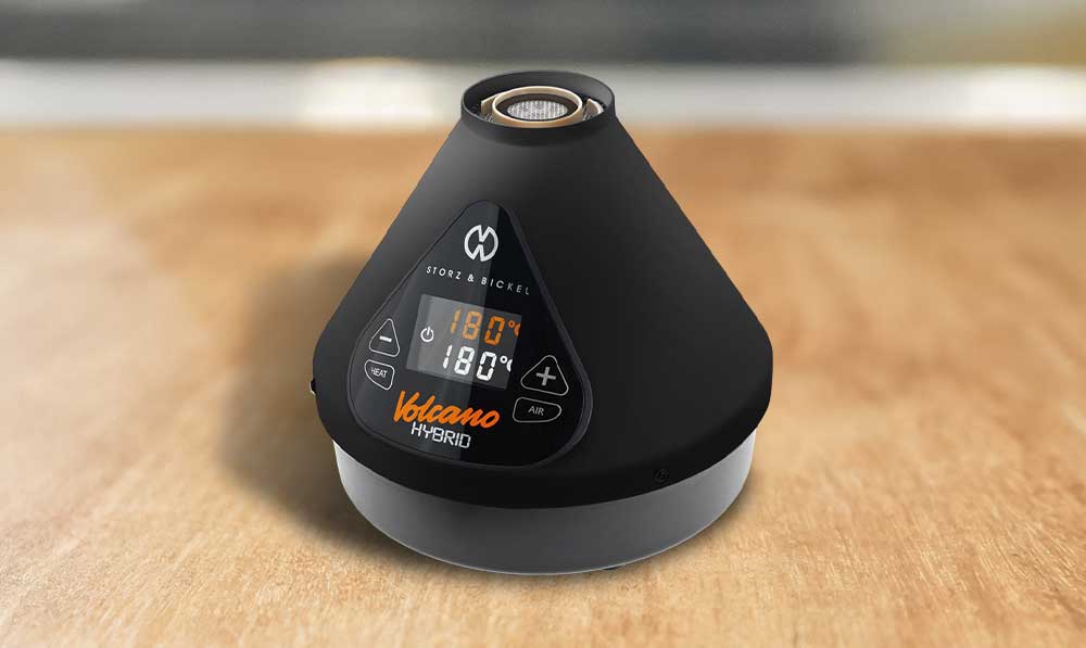 Black Storz and Bickel Volcano Hybrid Onyx vaporizer on a wooden table