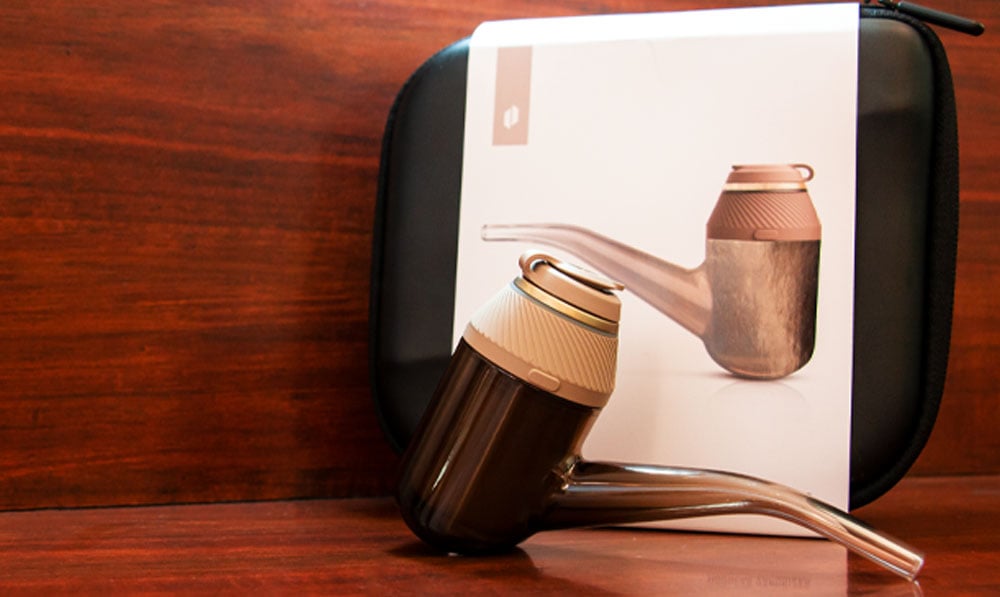 Puffco Proxy Desert Edition standing on wooden table with box