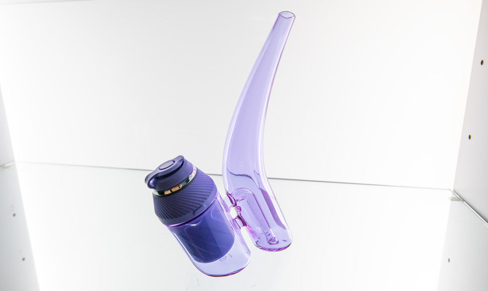 Puffco Proxy with glass bubbler sitting on glass counter