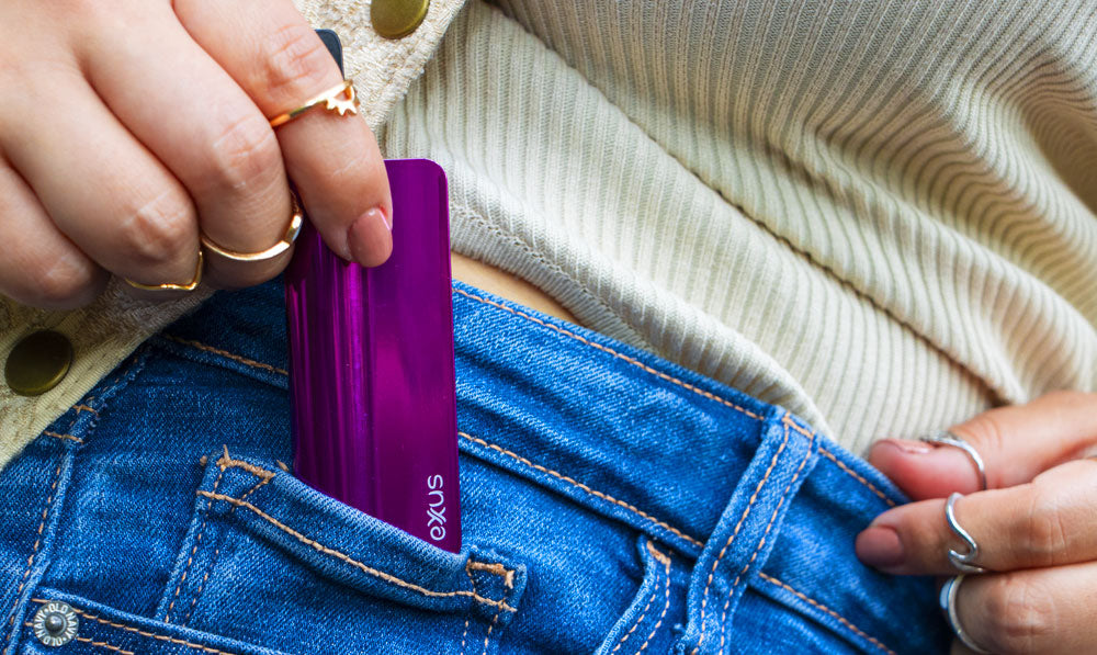 Woman pulling Exxus Snap VV Pro out of her pocket