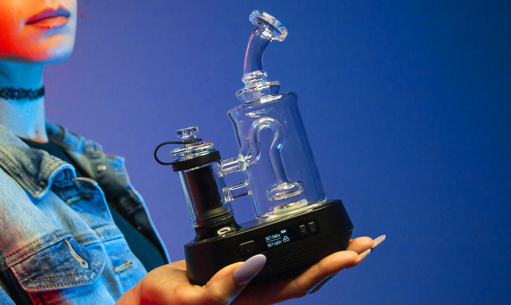 Woman holding Exxus Go Plus in front
