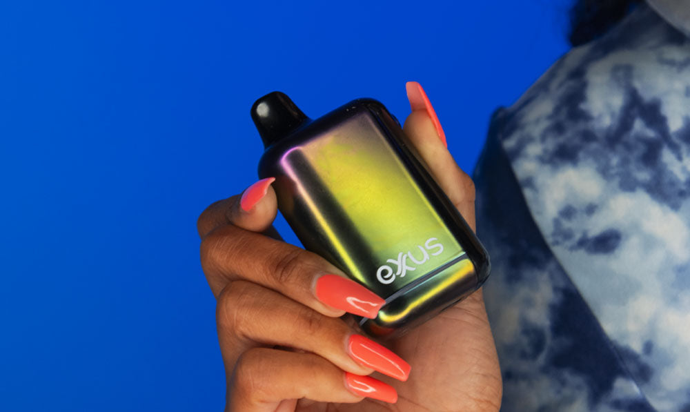 Woman holding Exxus Snap DLX in front of blue studio background