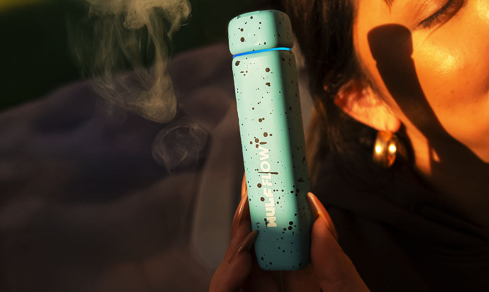 Person holding a WULF Flow vaporizer in sunlight