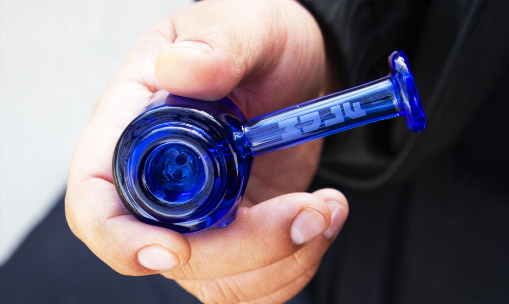 Man holding Wulf Gavel hand pipe outside
