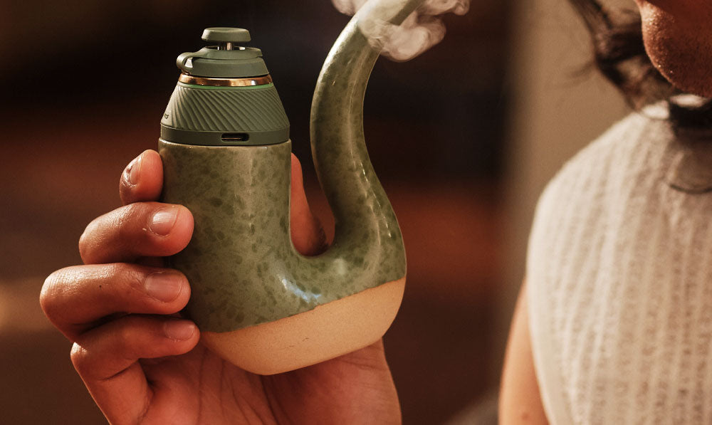 Hand holding a Puffco Terrapine electronic rig