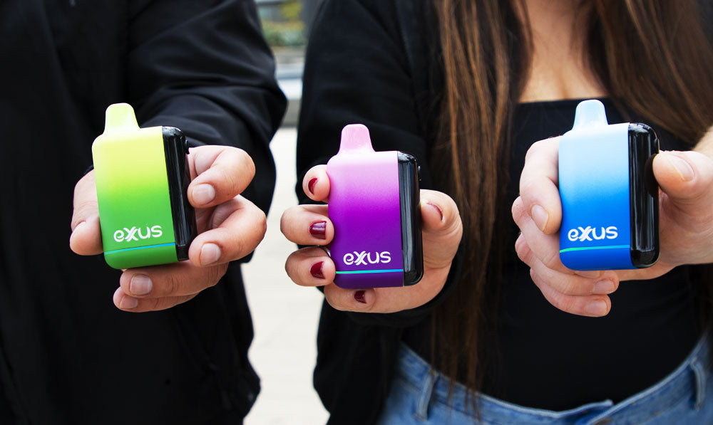 Group of people holding Exxus Snap DLX under sunlight