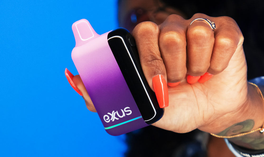 Woman holding Galaxy Exxus Snap DLX in front of blue studio background