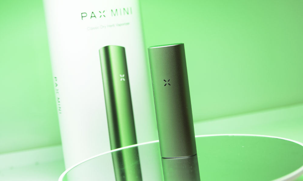 PAX Mini 2 on reflective surface with green lighting