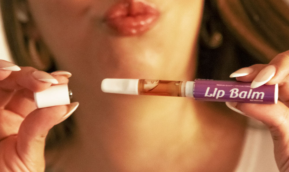 Woman holding Smyle Chapstick apart