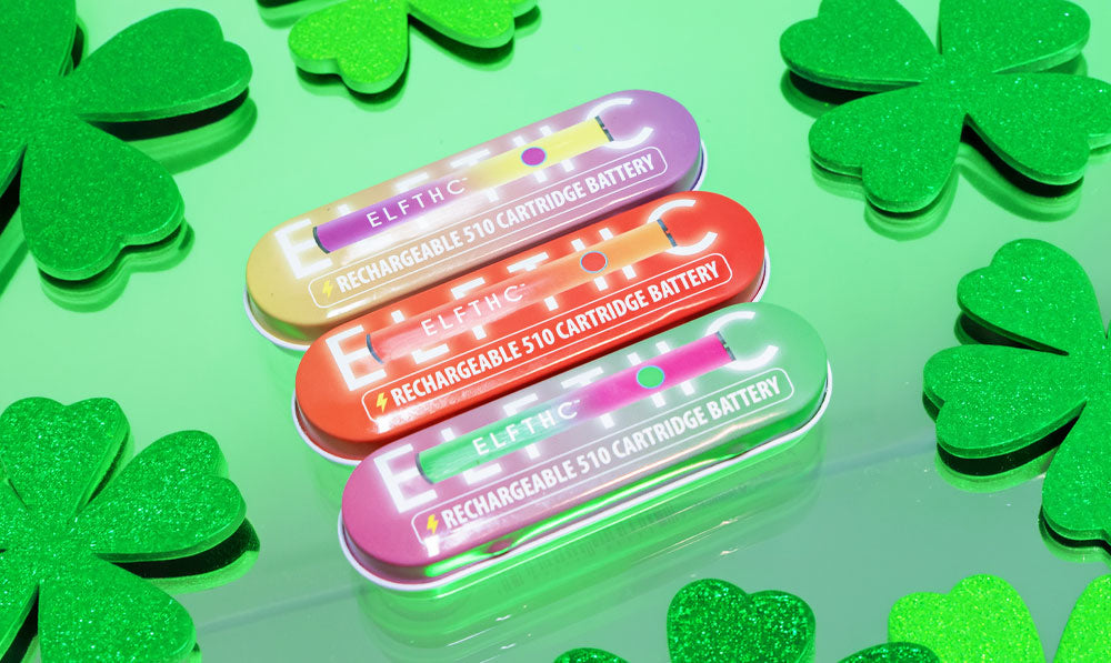 Elf Hardware Stick on reflective surface with green lighting and St. Patrick's Day clovers nearby