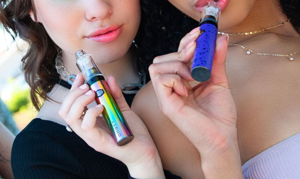 two women holding Wulf Orbit at park