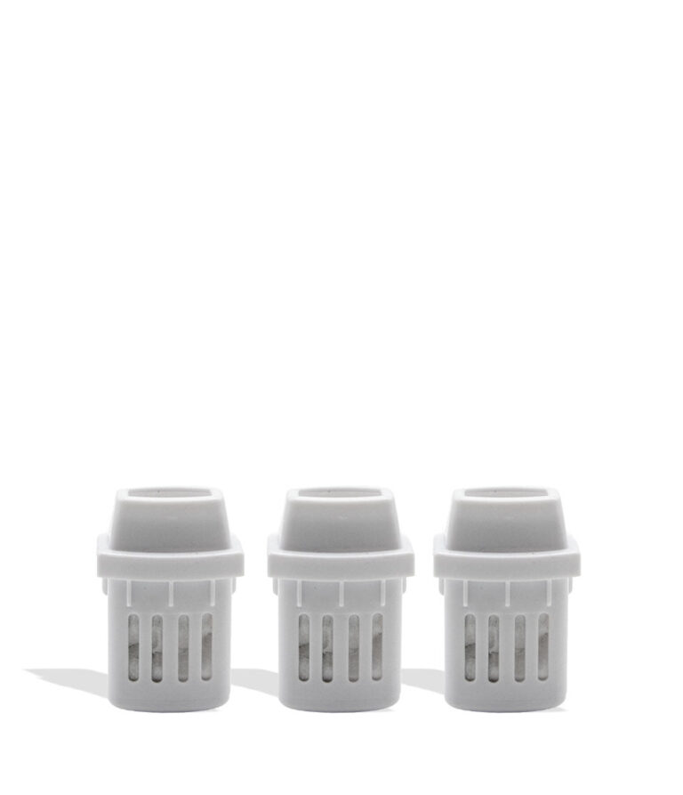Three white plastic inhaler pieces on a white background