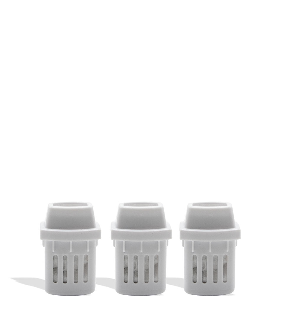 Three white plastic inhaler pieces on a white background