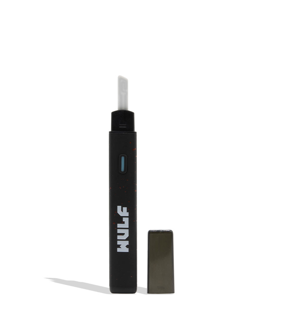 A black portable vape device with a white mouthpiece and the brand name 'WULF printed vertically in white, shown next to its dark gray rectangular cap on a white background.