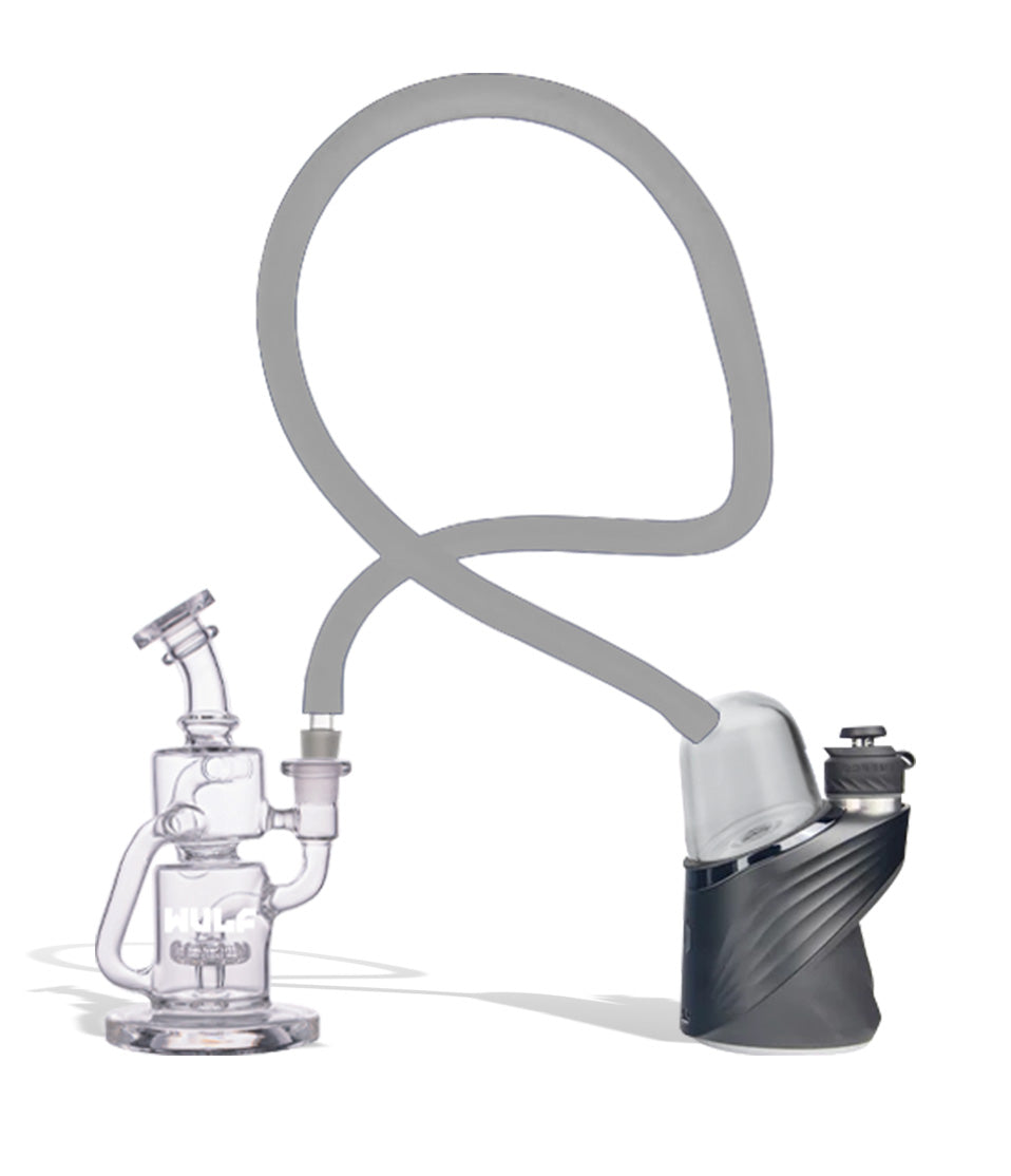 WULF Link in clear connecting a Puffco Peak to a glass recycler