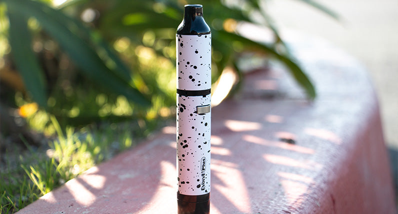 White and Black Spatter Wulf Evolve Plus standing outside on curb