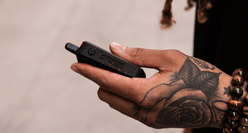 man holding Wulf UNI with fingers