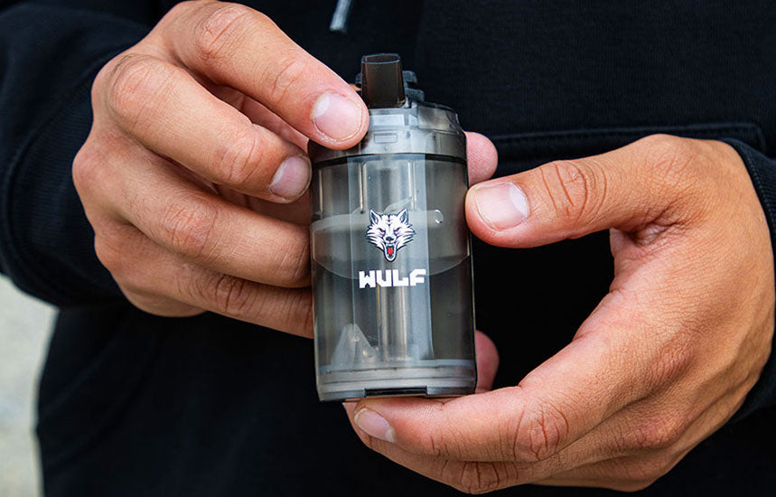 hand holding wulf growler back side
