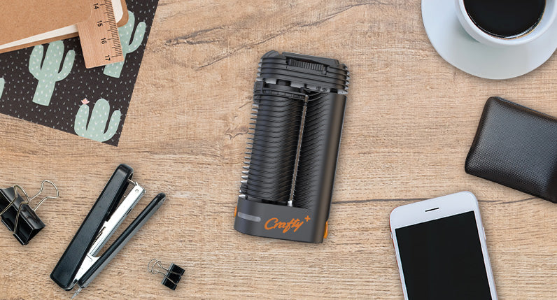 Storz and Bickel Crafty Plus laying down on table with office supplies