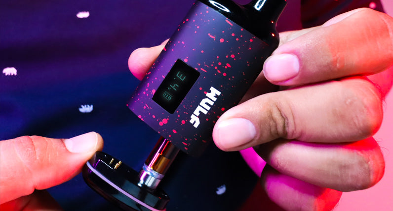 man holding Wulf Recon showing cartridge inside studio
