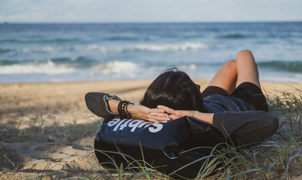 woman resting on beach lifestyle image