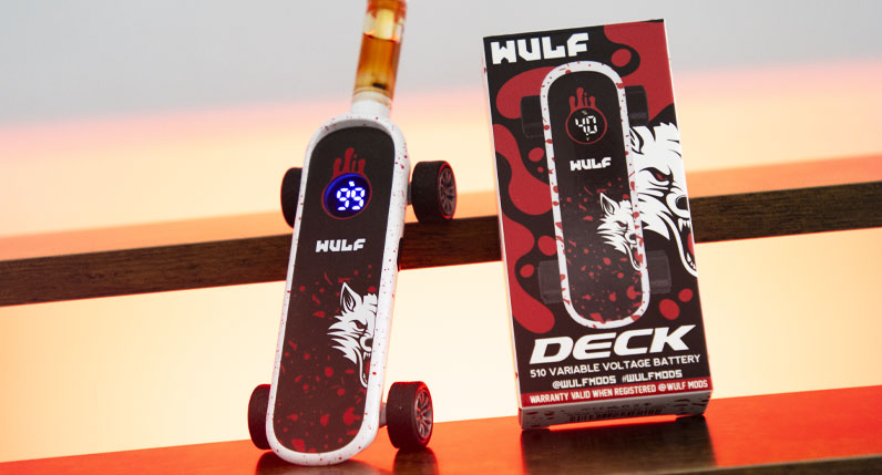 WULF Deck skateboard shaped 510 thread battery beside its retail box