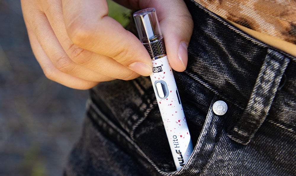 Wulf hito knife kit black red spatter coming out of jeans pocket lifestyle image