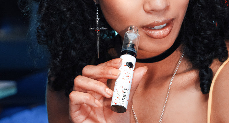 Close up of the WULF Orbit concentrate vaporizer atomizer and glass attachment