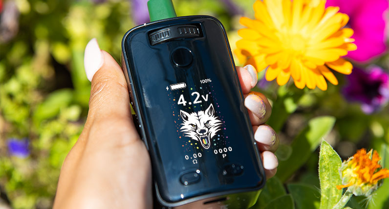 Woman holding the Wulf UNI 3.0 next to flowers